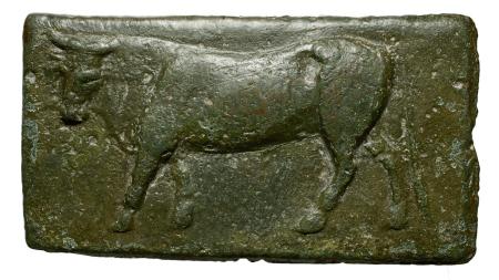 Monnaie de bronze avec un marquage en forme de bovidé